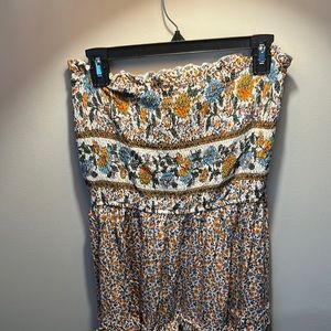 Boho style maxi dress with blue and yellow floral detailing and rouged strapless